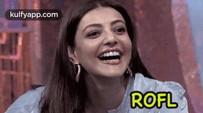 A Close Up Of A Woman 'S Face With The Word Rofl On It . GIF