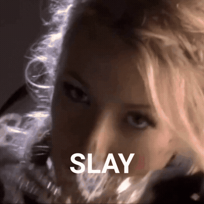 A Close Up Of A Woman 'S Face With The Word Slay Written Above Her GIF