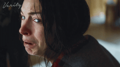 A Close Up Of A Woman 'S Face With The Word Verity On The Bottom Right GIF