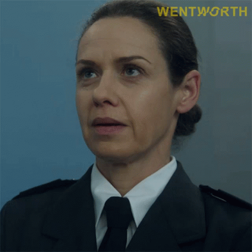 A Close Up Of A Woman 'S Face With The Word Wentworth On The Bottom Right GIF