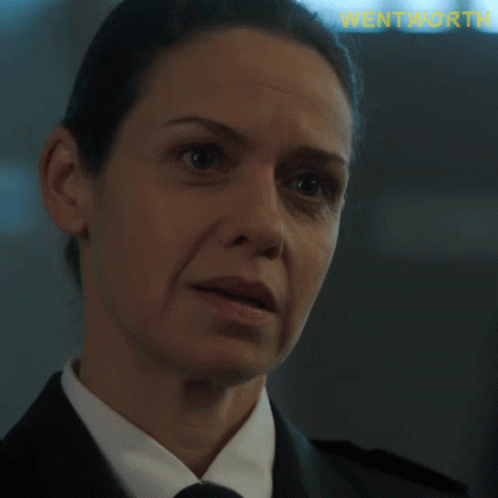 A Close Up Of A Woman 'S Face With The Word Wentworth Visible GIF