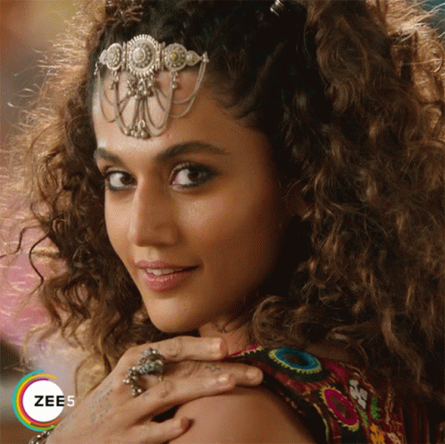 A Close Up Of A Woman 'S Face With The Word Zee5 On The Bottom Left GIF