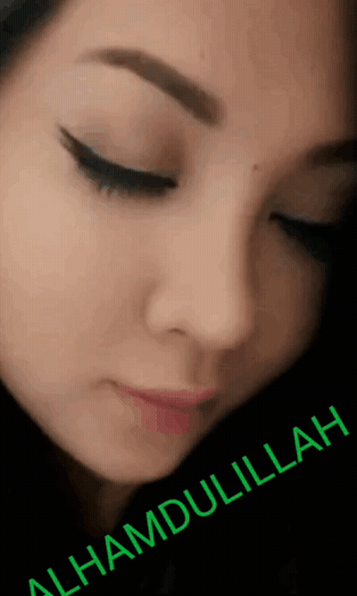 A Close Up Of A Woman 'S Face With The Words " Alhamdulillah " Written Below It GIF