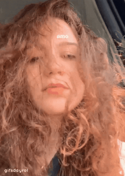 A Close Up Of A Woman 'S Face With The Words Amo On Her Forehead GIF