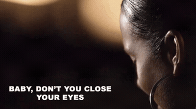 A Close Up Of A Woman 'S Face With The Words Baby , Don 'T You Close Your Eyes Written Below Her GIF
