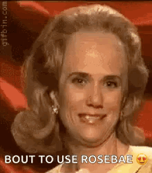 A Close Up Of A Woman 'S Face With The Words `` Bout To Use Rosebae '' Written On The Bottom . GIF