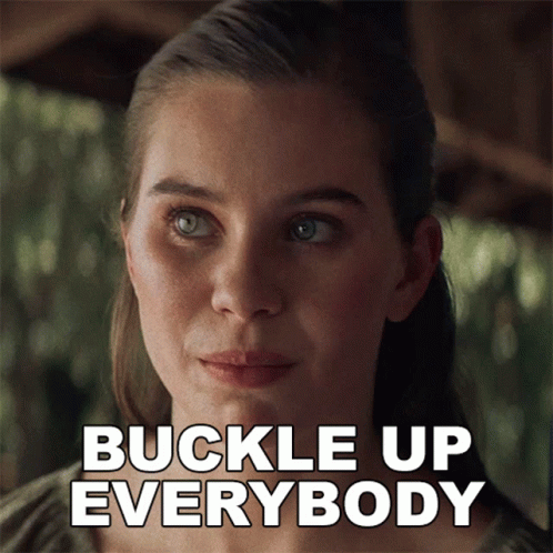 A Close Up Of A Woman 'S Face With The Words Buckle Up Everybody Above Her GIF