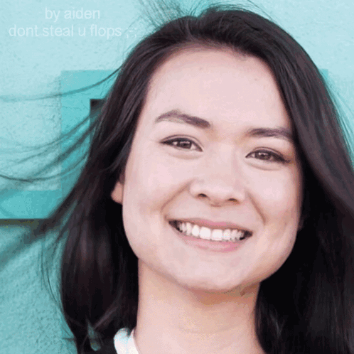 A Close Up Of A Woman 'S Face With The Words By Aiden Dont Steal U Flops GIF