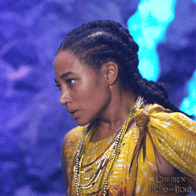 A Close Up Of A Woman 'S Face With The Words Children Of Blood And Bone In The Corner GIF