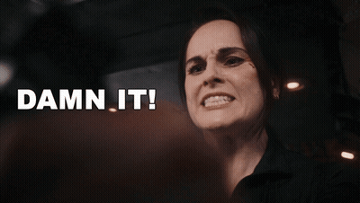 A Close Up Of A Woman 'S Face With The Words Damn It Behind Her GIF