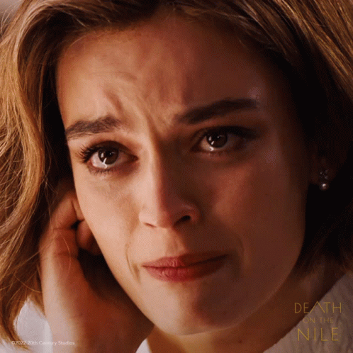 A Close Up Of A Woman 'S Face With The Words Death And Nile On The Bottom Right GIF