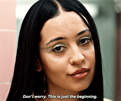 A Close Up Of A Woman 'S Face With The Words " Do N't Worry This Is Just The Beginning " GIF