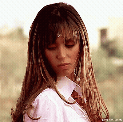A Close Up Of A Woman 'S Face With The Words Edits Portiranoni Below Her GIF