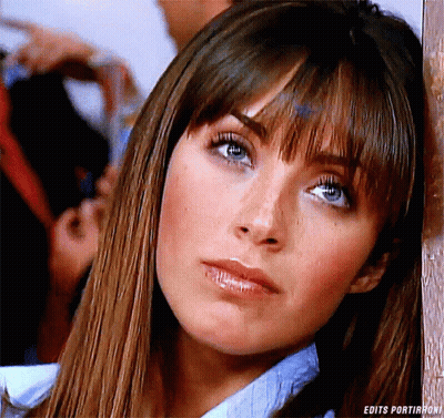 A Close Up Of A Woman 'S Face With The Words Edits Portirroni On The Bottom GIF