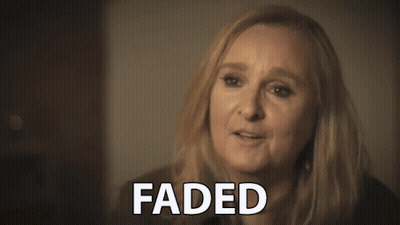A Close Up Of A Woman 'S Face With The Words Faded Written On It . GIF
