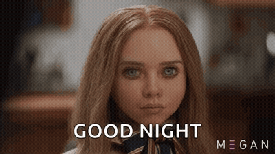 A Close Up Of A Woman 'S Face With The Words `` Good Night '' Written On Her Face . GIF