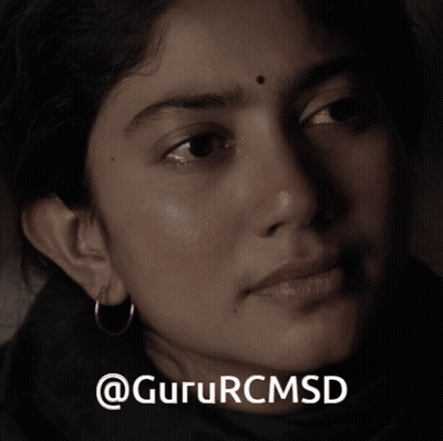 A Close Up Of A Woman 'S Face With The Words Gururcmsd On The Bottom Right GIF