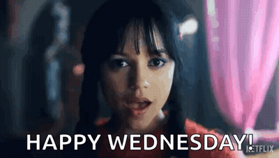 A Close Up Of A Woman 'S Face With The Words `` Happy Wednesday '' Written On It . GIF