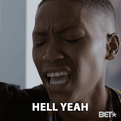 A Close Up Of A Woman 'S Face With The Words Hell Yeah Written Below Her GIF