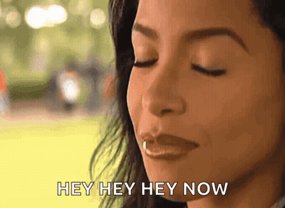 A Close Up Of A Woman 'S Face With The Words Hey Hey Hey Now Written Below Her GIF
