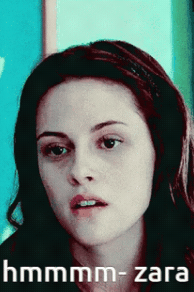 A Close Up Of A Woman 'S Face With The Words Hmmmm-Zara Written Below Her GIF