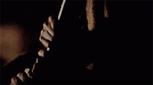 A Close Up Of A Woman 'S Face With The Words Hold Me Back GIF
