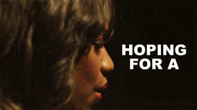 A Close Up Of A Woman 'S Face With The Words Hoping For A GIF