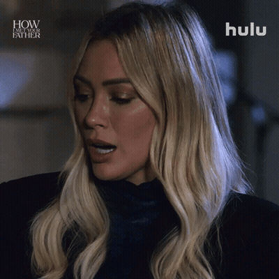 A Close Up Of A Woman 'S Face With The Words How I Met Your Father Above Her GIF