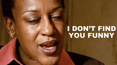 A Close Up Of A Woman 'S Face With The Words I Don 'T Find You Funny Above Her GIF