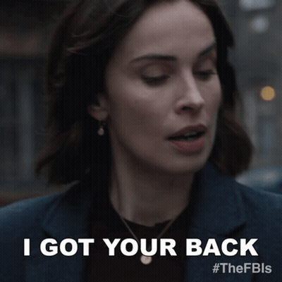 A Close Up Of A Woman 'S Face With The Words I Got Your Back Above Her GIF