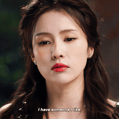 A Close Up Of A Woman 'S Face With The Words I Have Someone I Like GIF