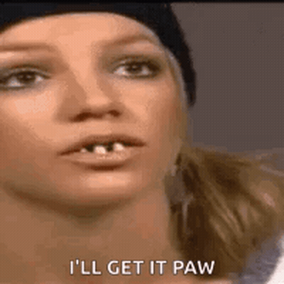 A Close Up Of A Woman 'S Face With The Words `` I 'Ll Get It Paw '' Written Next To Her . GIF