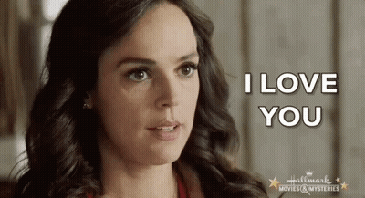 A Close Up Of A Woman 'S Face With The Words I Love You Written On It GIF