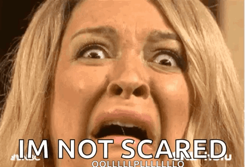 A Close Up Of A Woman 'S Face With The Words I 'M Not Scared Below It GIF