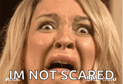 A Close Up Of A Woman 'S Face With The Words I 'M Not Scared On The Bottom GIF