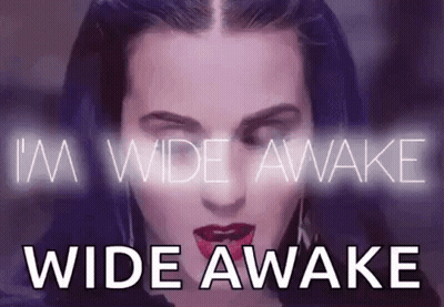 A Close Up Of A Woman 'S Face With The Words `` I 'M Wide Awake Wide Awake '' GIF