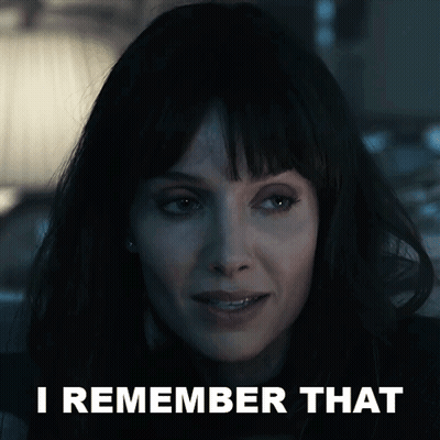 A Close Up Of A Woman 'S Face With The Words I Remember That Behind Her GIF