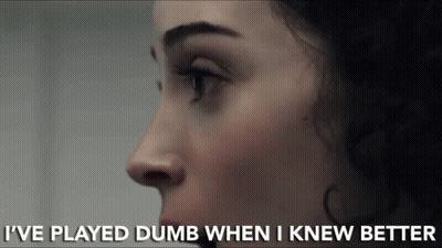 A Close Up Of A Woman 'S Face With The Words I 'Ve Played Dumb When I Knew Better Below It GIF
