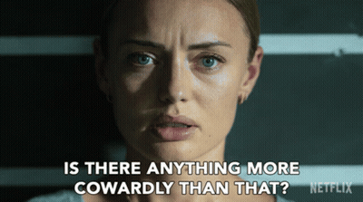 A Close Up Of A Woman 'S Face With The Words " Is There Anything More Cowardly Than That " Below Her GIF
