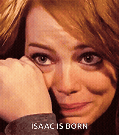 A Close Up Of A Woman 'S Face With The Words Isaac Is Born Below Her GIF
