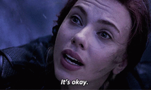 A Close Up Of A Woman 'S Face With The Words " It 'S Okay " Below Her GIF