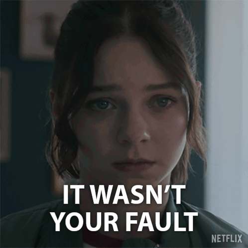 A Close Up Of A Woman 'S Face With The Words " It Wasn 'T Your Fault " On The Bottom GIF