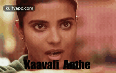 A Close Up Of A Woman 'S Face With The Words Kaavali Anthe Written In Black . GIF