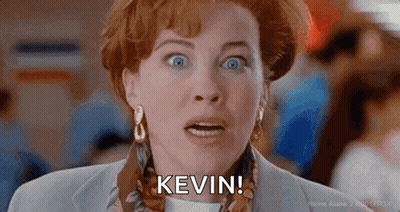 A Close Up Of A Woman 'S Face With The Words `` Kevin '' Written On It . GIF