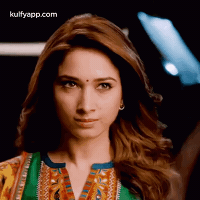 A Close Up Of A Woman 'S Face With The Words Kulfyapp.com At The Top GIF