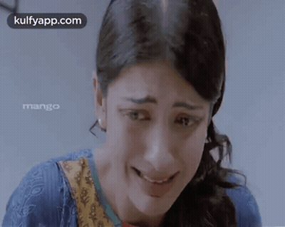 A Close Up Of A Woman 'S Face With The Words Kulfyapp.com Written On The Bottom GIF
