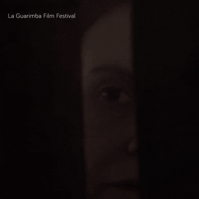 A Close Up Of A Woman 'S Face With The Words La Guarimba Film Festival Below GIF