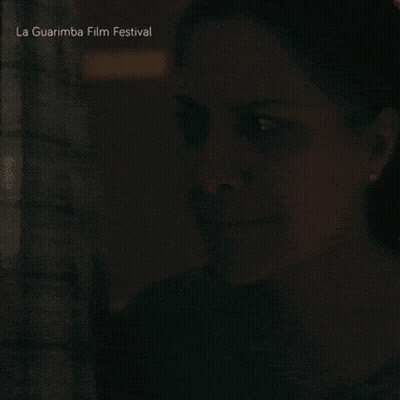 A Close Up Of A Woman 'S Face With The Words La Guarimba Film Festival Below GIF