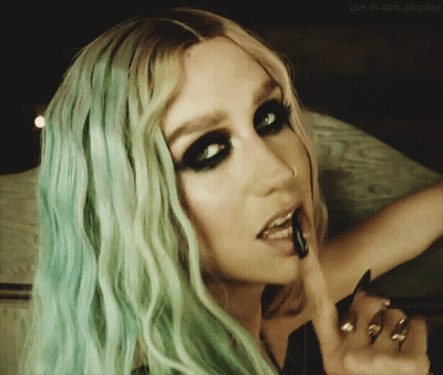 A Close Up Of A Woman 'S Face With The Words Live-In-Dark-Paradise On The Bottom Right GIF