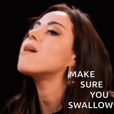 A Close Up Of A Woman 'S Face With The Words `` Make Sure You Swallow '' On It . GIF